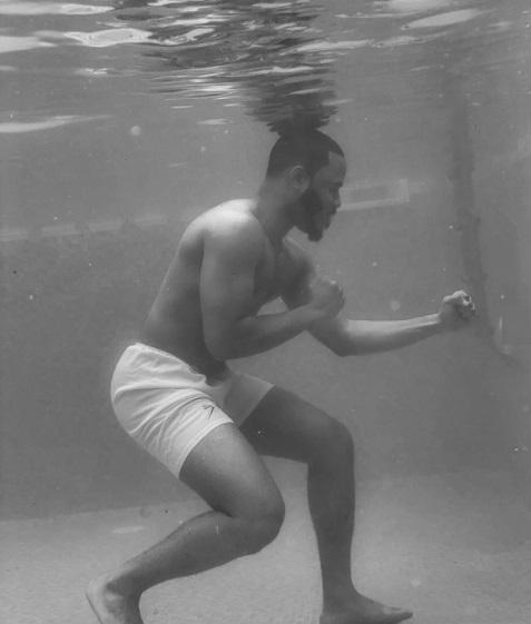 BBNaija star, Ozo Recreates 1961 Picture Of Muhammad Ali Training In A Pool