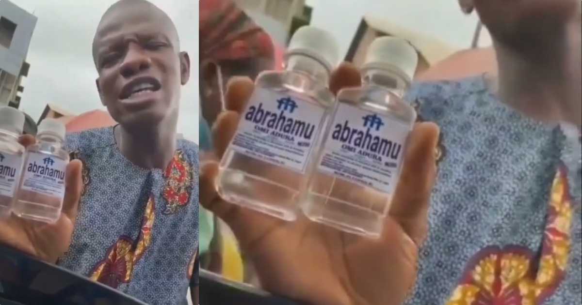 Pastor spotted selling N200 'get rich' holy water in Lagos traffic (Video)