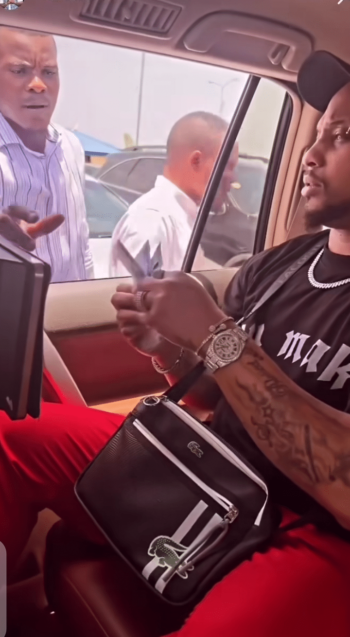 Davido's cousin, B-red spotted giving out money on the street (Video)