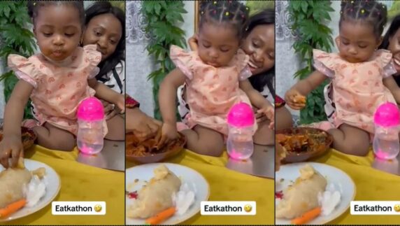 Baby causes a stir as she drags bowl of eba with mother (Video)