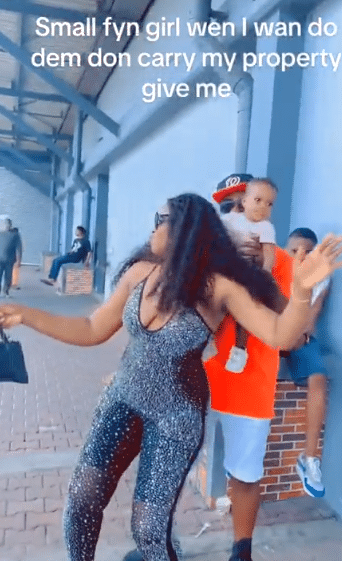 Wife causes buzz as she tries to form slay queen in public, husband quickly hands her their baby, she reacts