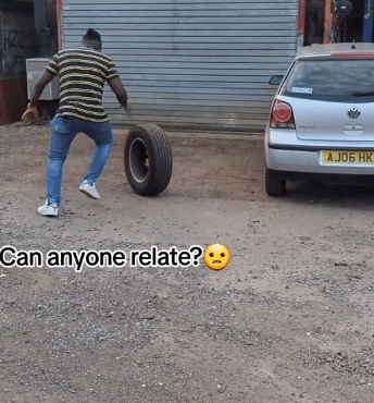 Man living abroad causes buzz as he finds old car tyre, plays with it like a child, his Oyinbo wife watches him in disbelief