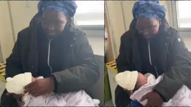 Emotional moment mother carries grandchild for the first time